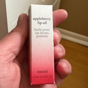 Nooni Appleberry Lip Oil,brand new never opened.